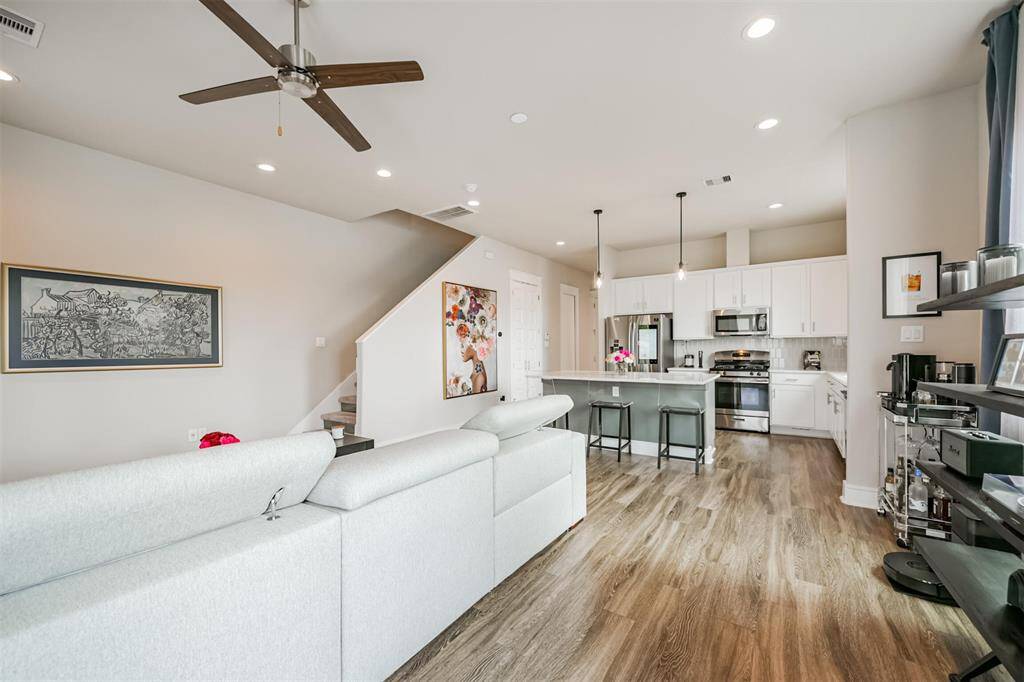 Kitchen features a gas stove and built in microwave with vent.