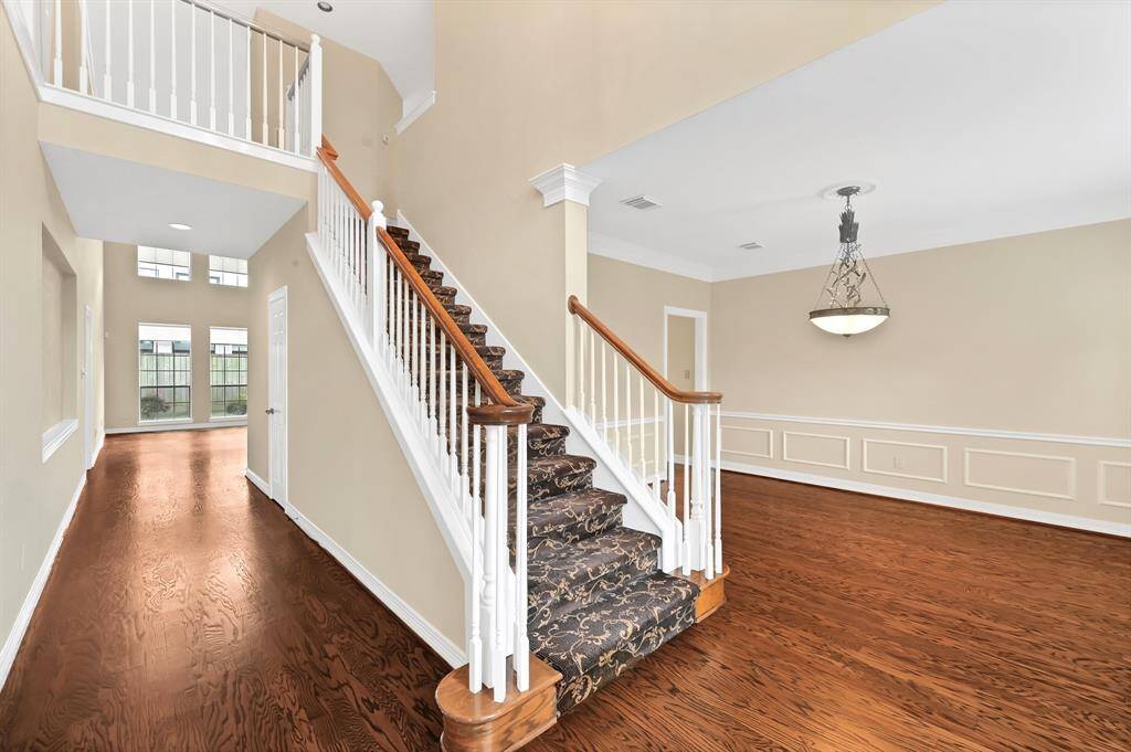 As you walk through the door, two-story entryway greets you
