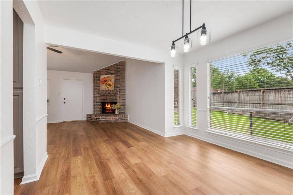 View from dining room into living room which also allows entry into the kitchen