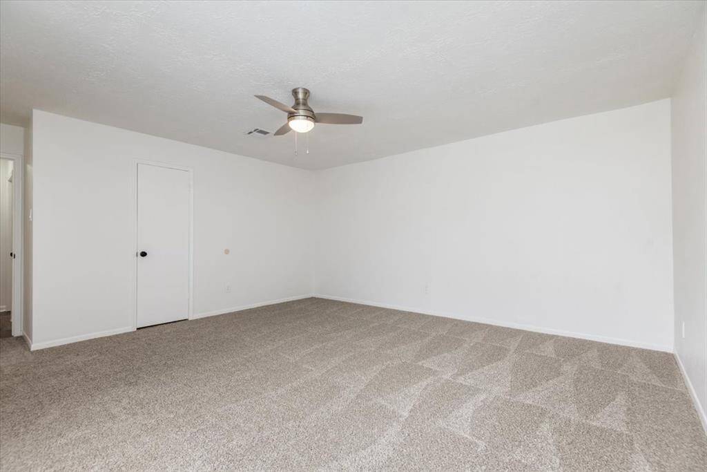 Another view of primary bedroom