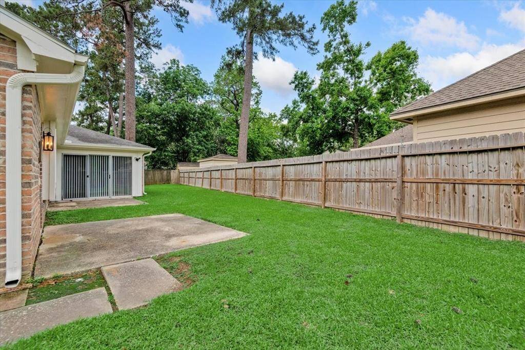 View of back yard with two patios