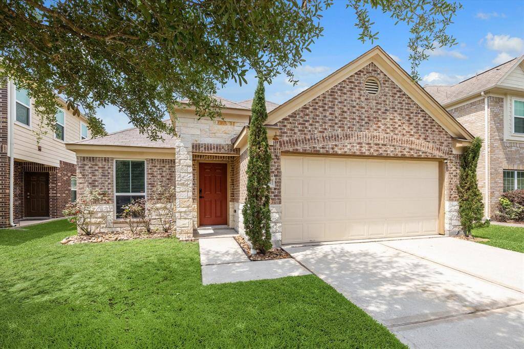 Beautiful single family home with brick and stone exterior