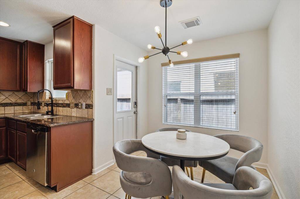 A modern light fixture is a statement piece to the dining space