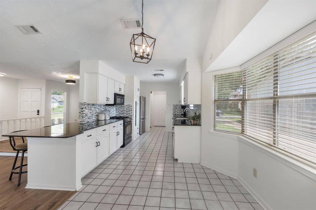 Spacious kitchen with dining area