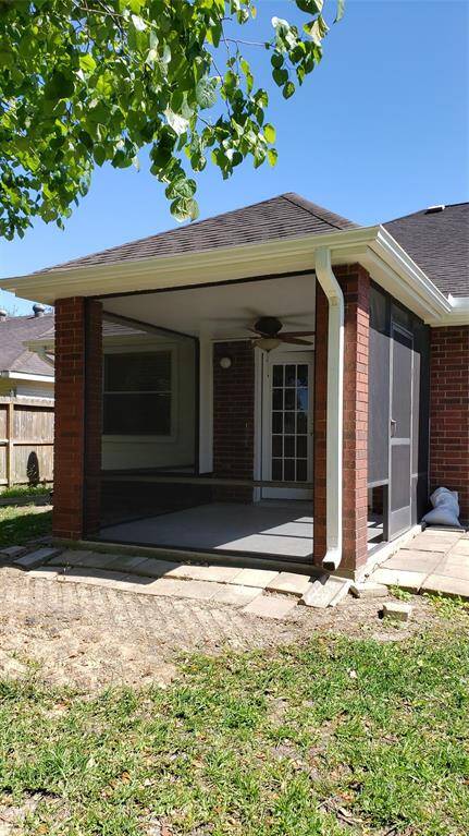 Screened in, covered patio in the back yard