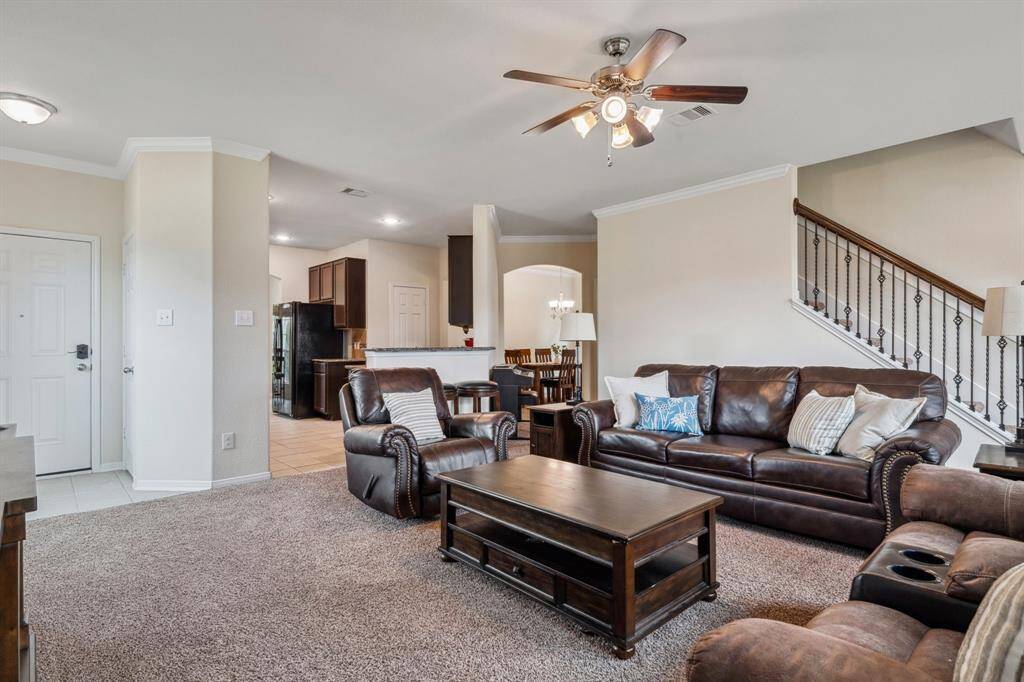 The living room leads to the large kitchen