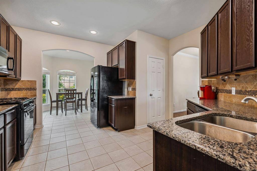 The kitchen has plenty of storage and counter space for all the cooks in your household