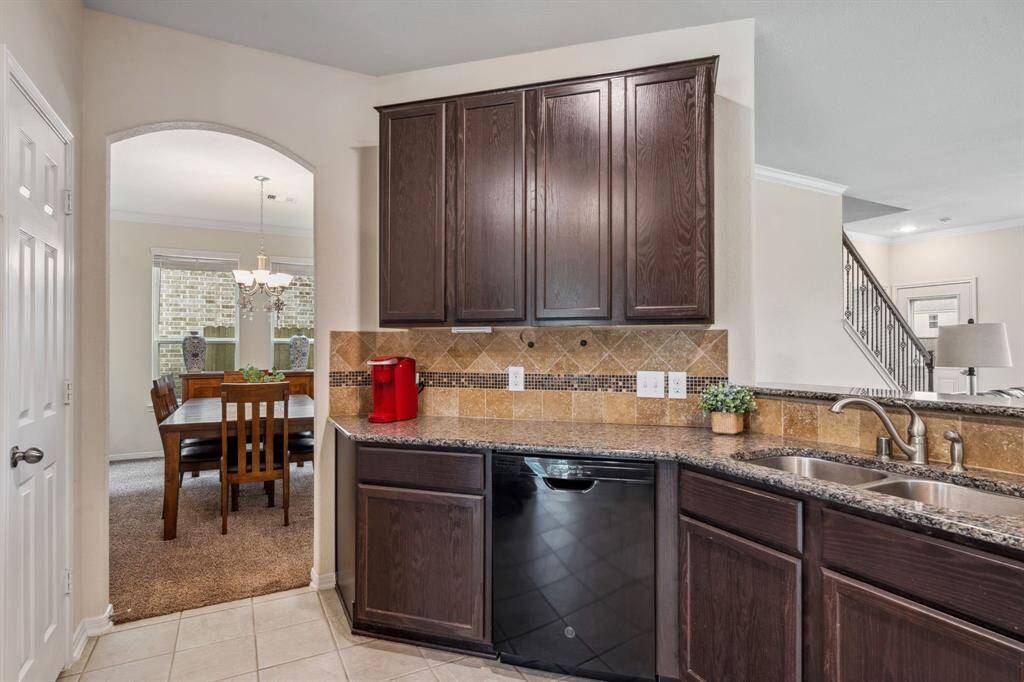 The formal dining is located on the other side of the kitchen