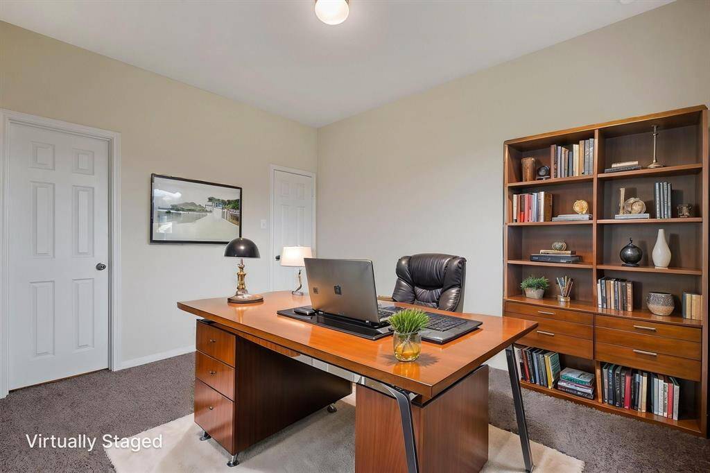 There is an office or 4th bedroom on the 1st floor. The door to back right leads to a walk in closet. The door to the left leads to the powder bath