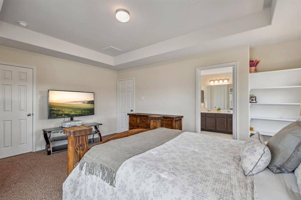 The primary suite has his/her closets. One of the closets is on the left through the doorway. The other is located throught the bath