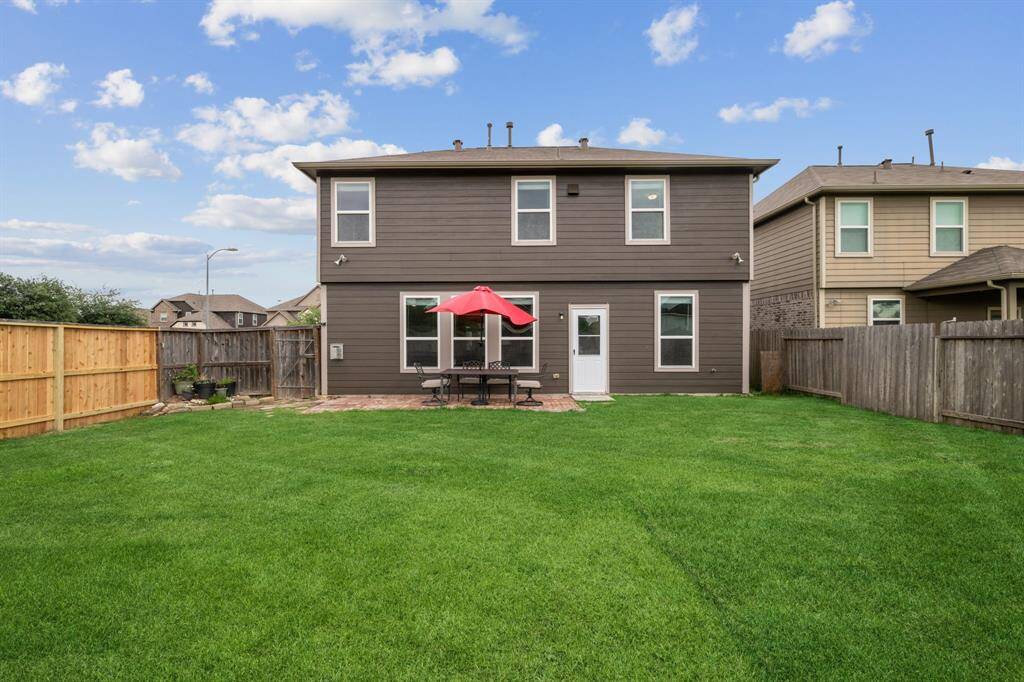 There is huge backyard with plenty of space for playground equipment and/or pool