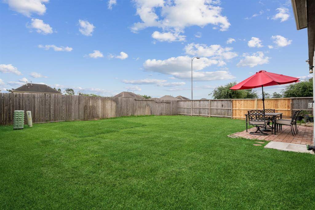 Sellers added a paver patio to the rear. All patio furniture will be sold with the home