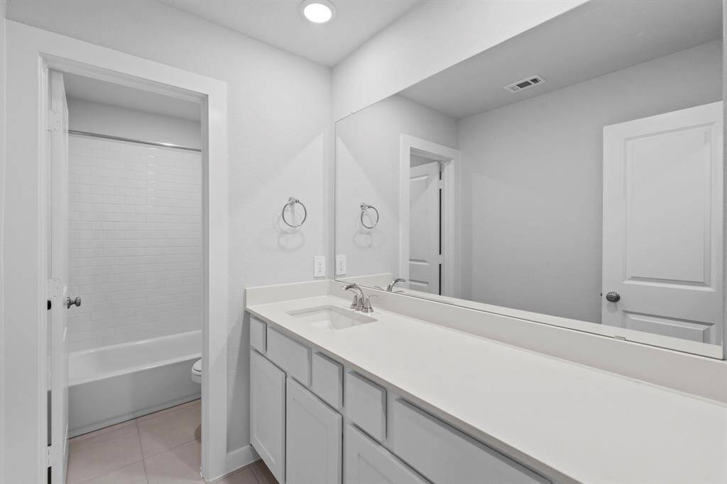 The third bathroom is conveniently located on the second floor, offering easy access for guests or family members.