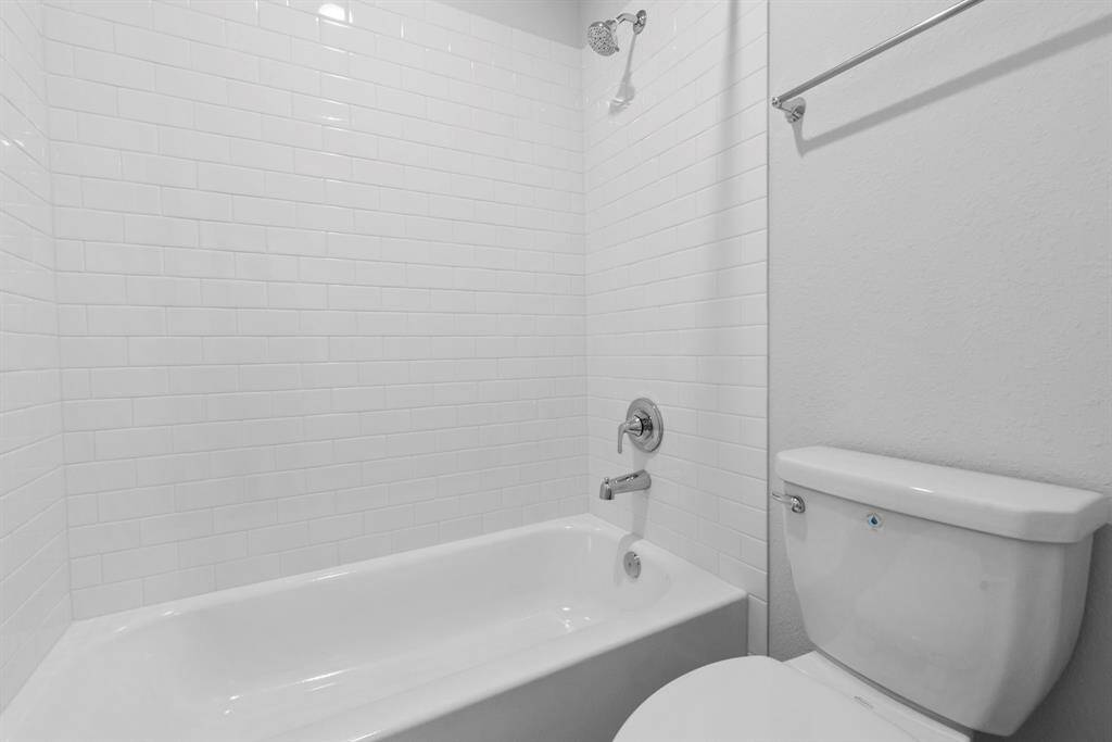 Another perspective of the third bathroom, featuring a combo shower/tub.