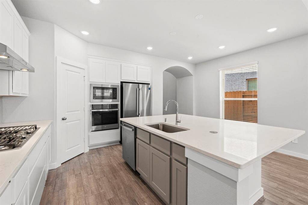 This functional kitchen will be the centerpiece for any social gathering.