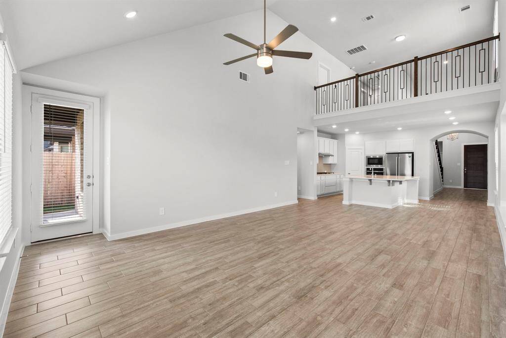 Perspective showing the family room and the access to the patio and backyard.