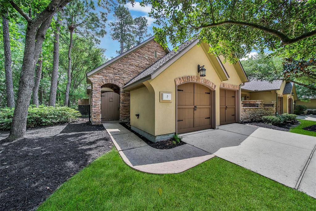 This end unit offers additional privacy and landscaping on the walk to the front courtyard.