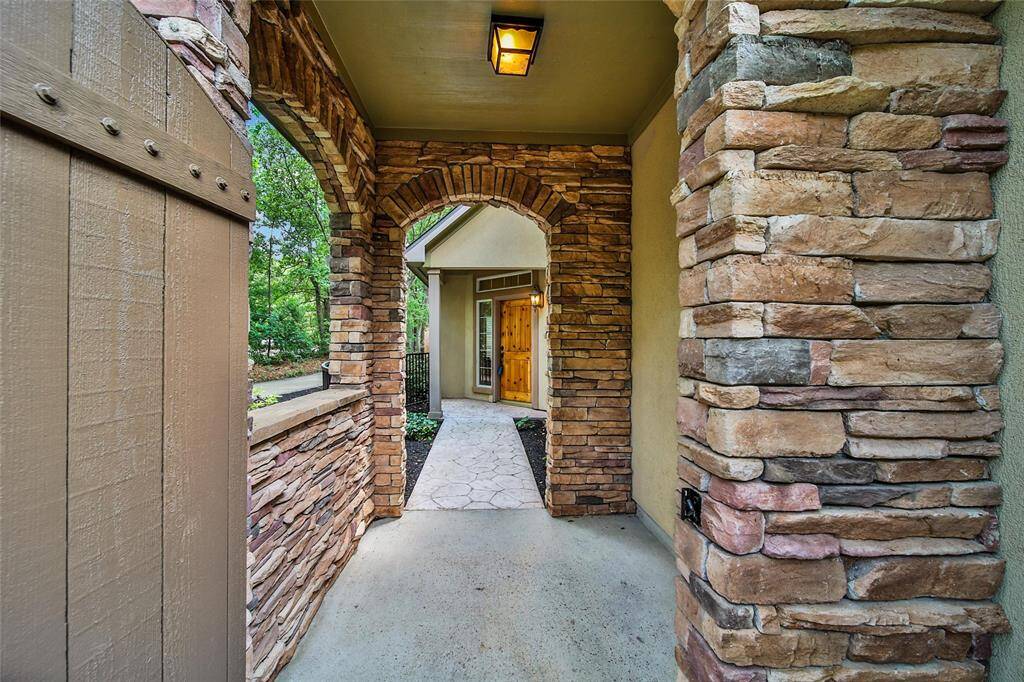 The gated courtyard is a charming walk to the front door.