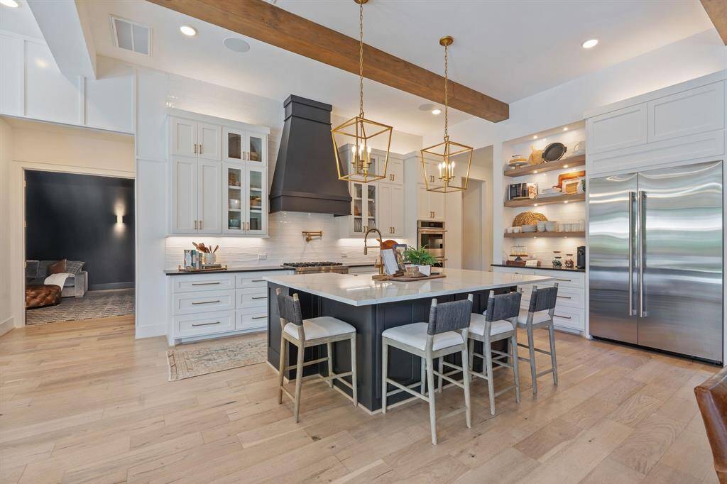 Beyond the kitchen is the media room that is perfect for movie night!