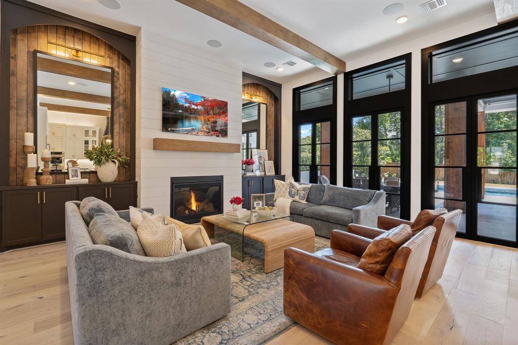 This striking wall of windows and doors adds a sophisticated, light-filled wow factor!