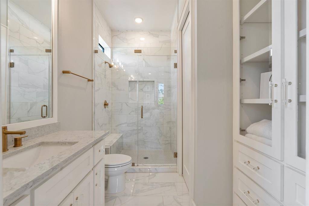 Ensuite luxurious bathroom off of the 4th secondary bedroom and has a nicely sized walk in closet.
