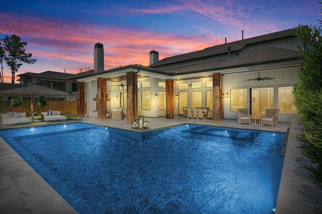 Unwind or entertain in style with this breathtaking outdoor space featuring a sparkling pool, integrated spa, and expansive covered patio. Soaring cedar columns, multiple lounge and dining areas, and glowing sunset views make this backyard feel like a private resort—perfect for year-round enjoyment and seamless indoor-outdoor living. Are you ready to call this HOME?
