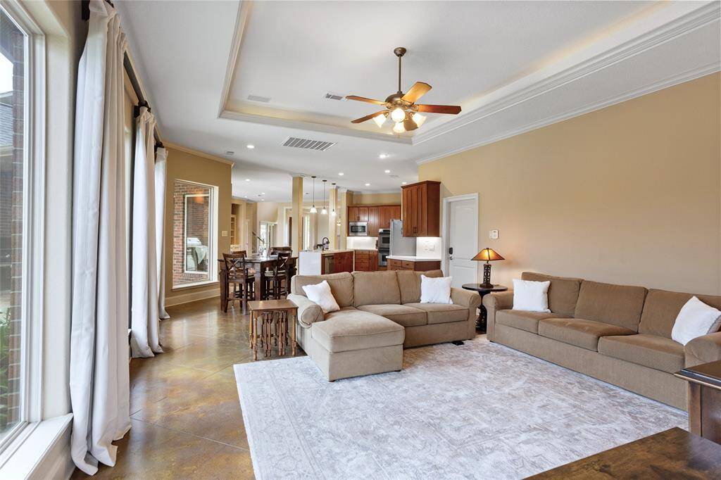 This view, looking back toward the front door, highlights the seamless flow between each living space, showcasing the open layout and natural connection between the rooms.
