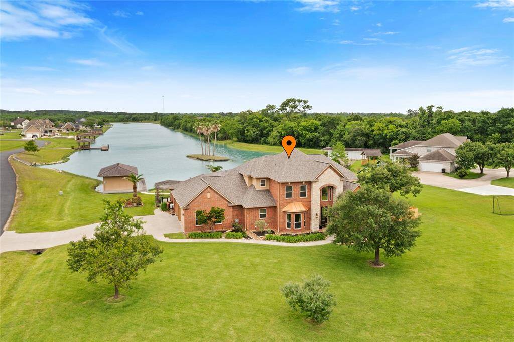 Enjoy sweeping lake views from the backyard and plenty of open green space to play at this waterfront home.