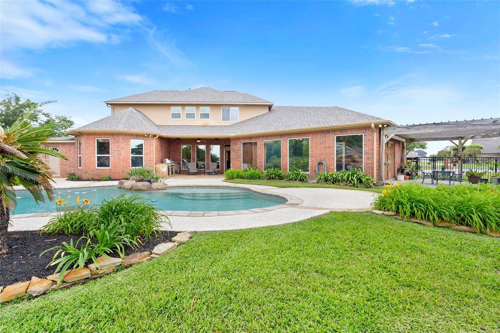 Enjoy the numerous spaces designed for relaxation in the backyard, all while taking in the serene and picturesque lakeside views.