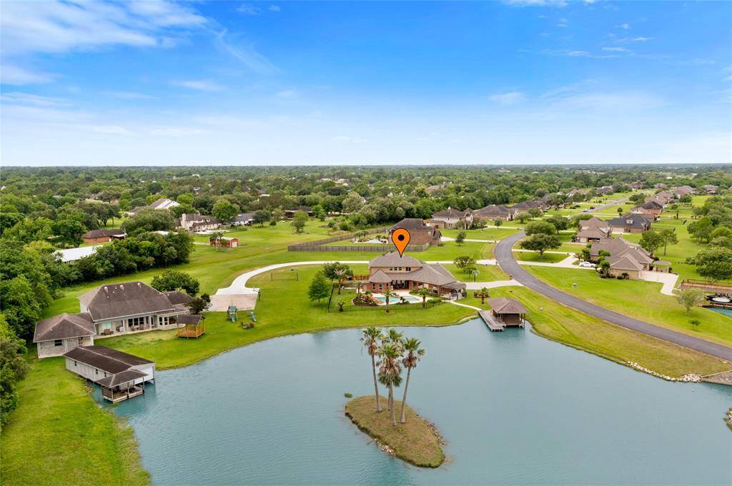 Looking back at this expansive 1-acre property in the desirable Lago Santa Fe community, you’ll appreciate the beautifully maintained grounds, spacious layout, and stunning natural surroundings that define this exceptional lakeside retreat.