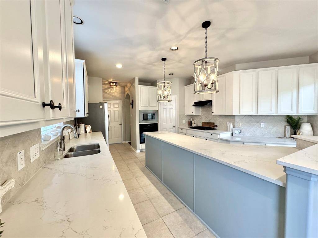 View of Kitchen heading towards the Utility Room and Dining Room.