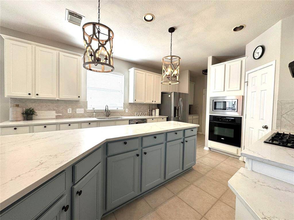 Window over sink. Tons of counter and Cabinet space