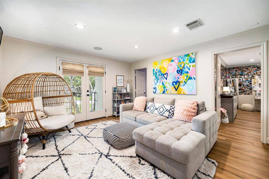 Two spacious secondary bedrooms upstairs share a private lounge area, complete with access to an outdoor balcony for added relaxation and enjoyment.