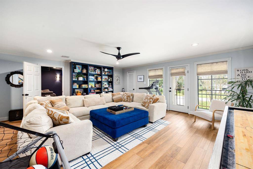 The main game room upstairs seamlessly connects to the media room, creating an ideal space for entertainment. It features a bar area, ample closet space, and access to an outdoor balcony, providing hours of fun for everyone!