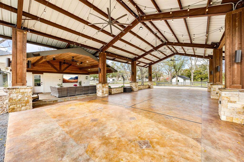 This expansive covered pavilion offers endless possibilities—ideal for hosting events, outdoor entertaining, or even storing an RV.