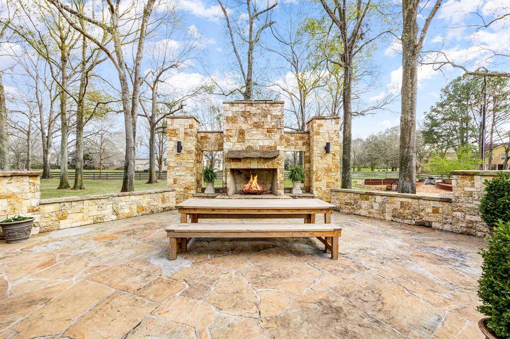 Enjoy your outdoor meals here or host that special birthday party! Wood-burning fireplace surrounded by a pasture full of mature trees and a custom built garden with raised, irrigated beds in the shape of a flower. Mosquito system keeps you comfortable so you have season after season in the great outdoors.
