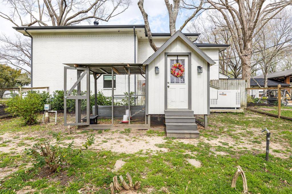 Designated, custom-designed chicken coop and yard with perimeter fencing. Generac generator can be seen in this photo.