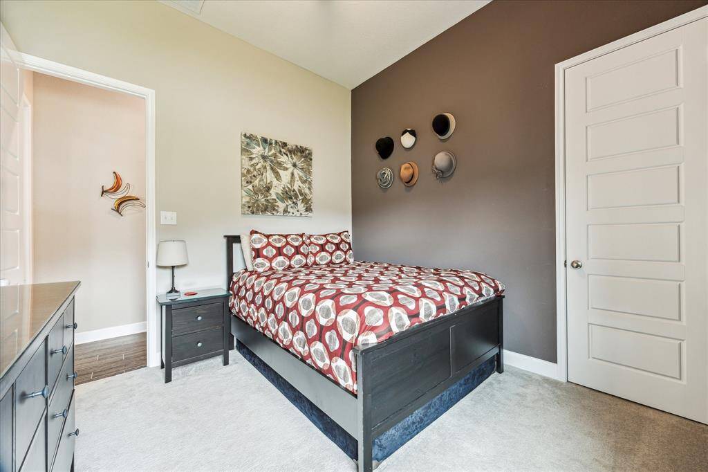 A glance at the third bedroom with earth tones.