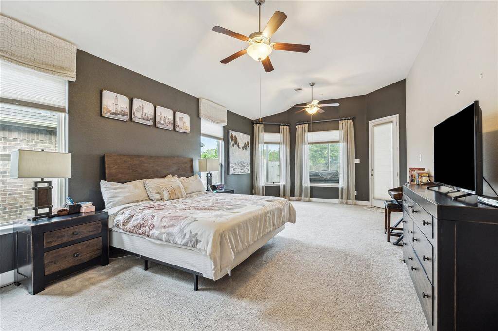 This stunning primary bedroom has everything you need. It leads to an enclosed patio to relax in the Hot Tub or to take a swim before calling it a night