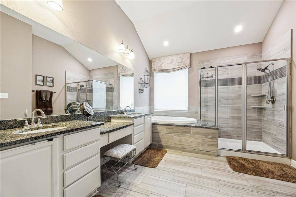 This property boasts a spacious primary bathroom with a deep soaking tub, offering a tranquil escape at the end of the day.