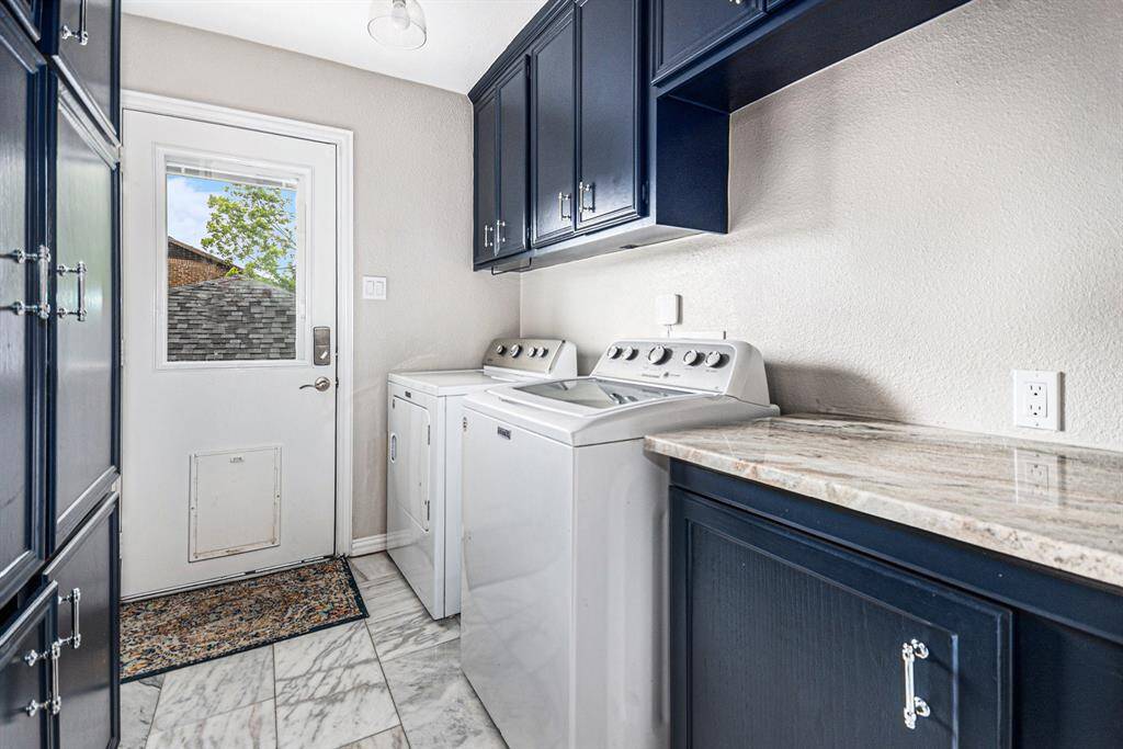 Laundry room with plenty of cabinets
