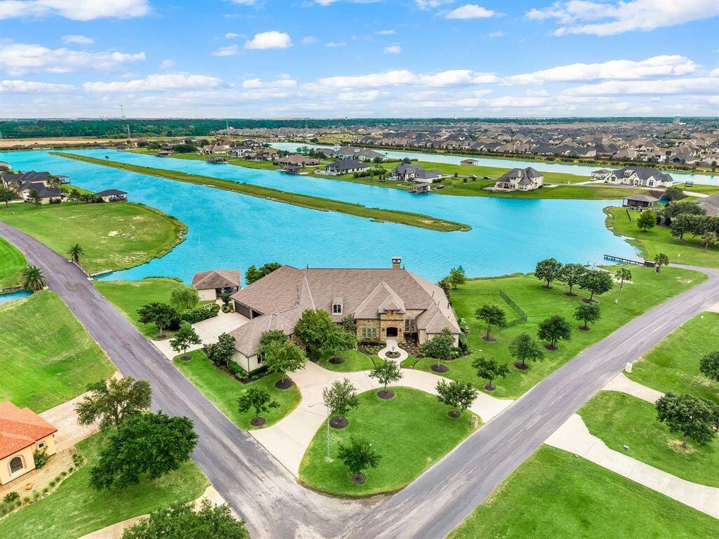 Have a front row seat to all your summer activities and sunsets in this gorgeous one-story home with breathtaking views of the lake.