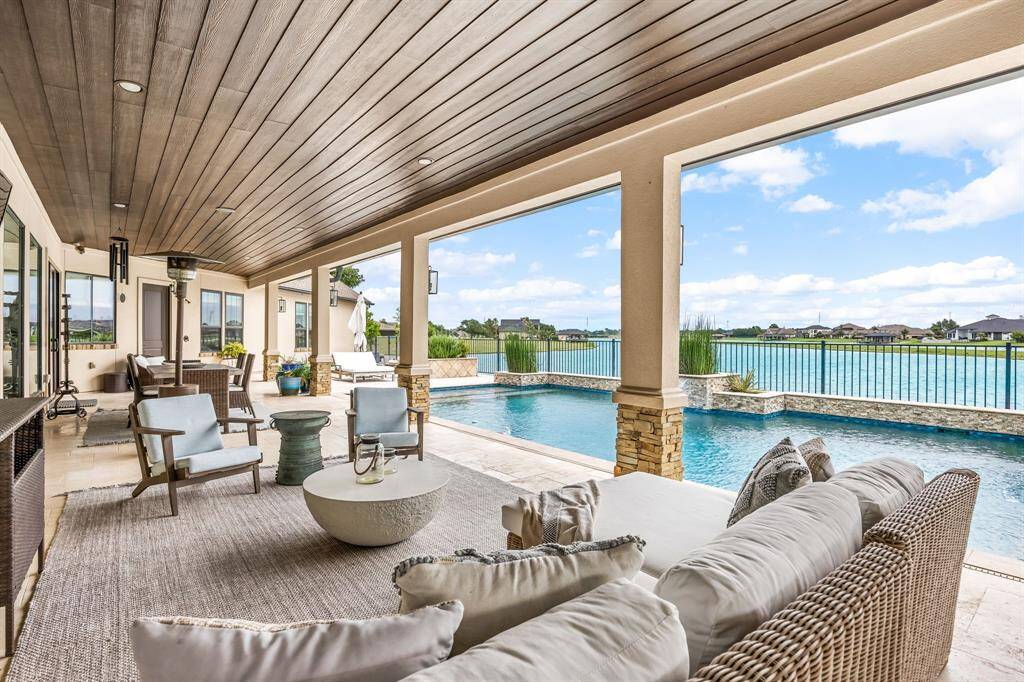 Thoughtfully curated furnishings from Pottery Barn and Restoration Hardware enhance the home’s elegant design, including the outdoor patio pieces. Furnishings are available for purchase.