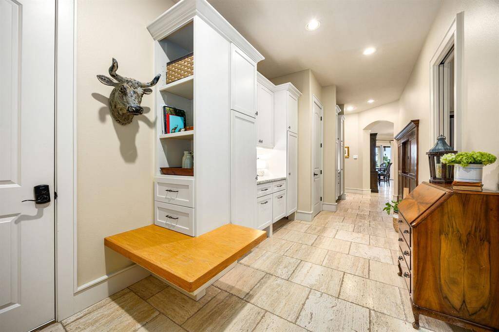 This custom mudroom is the ultimate blend of function and style-crafted to handle the daily flow of an active household with built-in cubbies and individual locker-style spaces.
