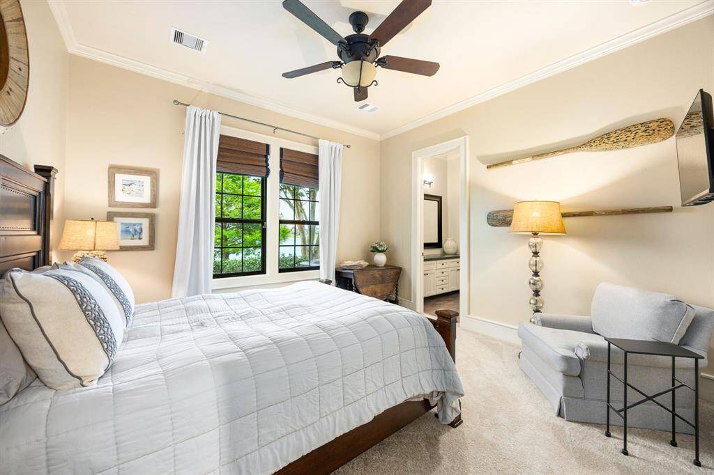 Generously-sized secondary bedrooms with lake views and a jack-n-jill bathroom with shared walk-in shower. Carpet has been recently replaced in secondary bedrooms.
