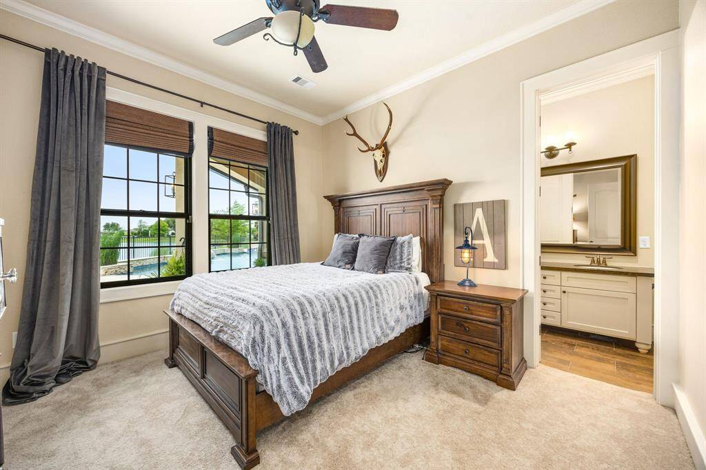 Secondary bedroom with recently-replaced carpet and Pella windows.