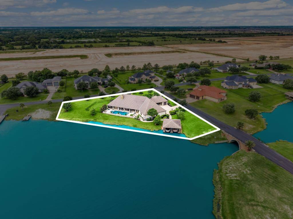 Sprawling waterfront estate in the private water-skiing community of Lakes of Katy.