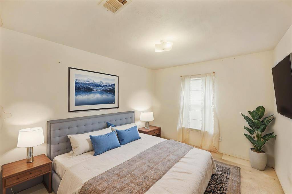 Virtually Staged: Secondary bedroom with carpet floors.