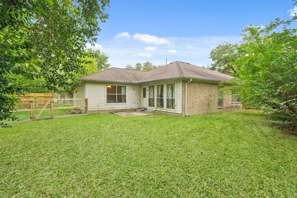Welcome to your new backyard! Check out all of that wonderful green space for the kids and pets to run around in, and a patio deck.