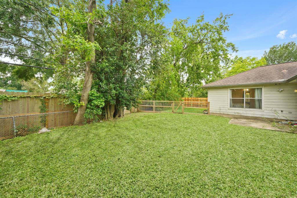This backyard features solid board fencing providing more privacy.